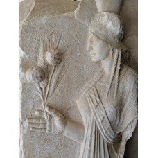 Demeter bearing the opium poppy and sheaves of wheat